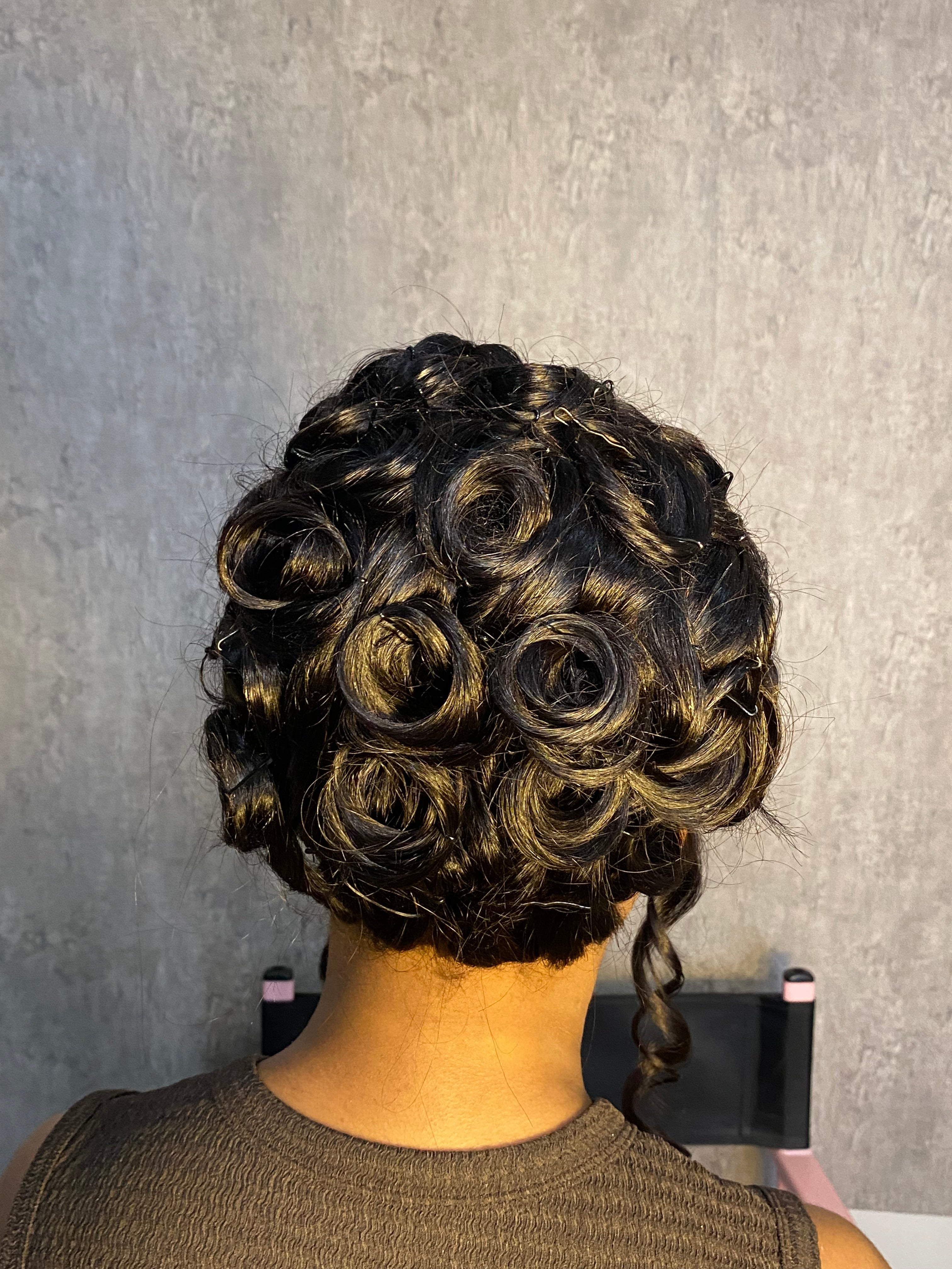 Bombshell French roll updo with bangs