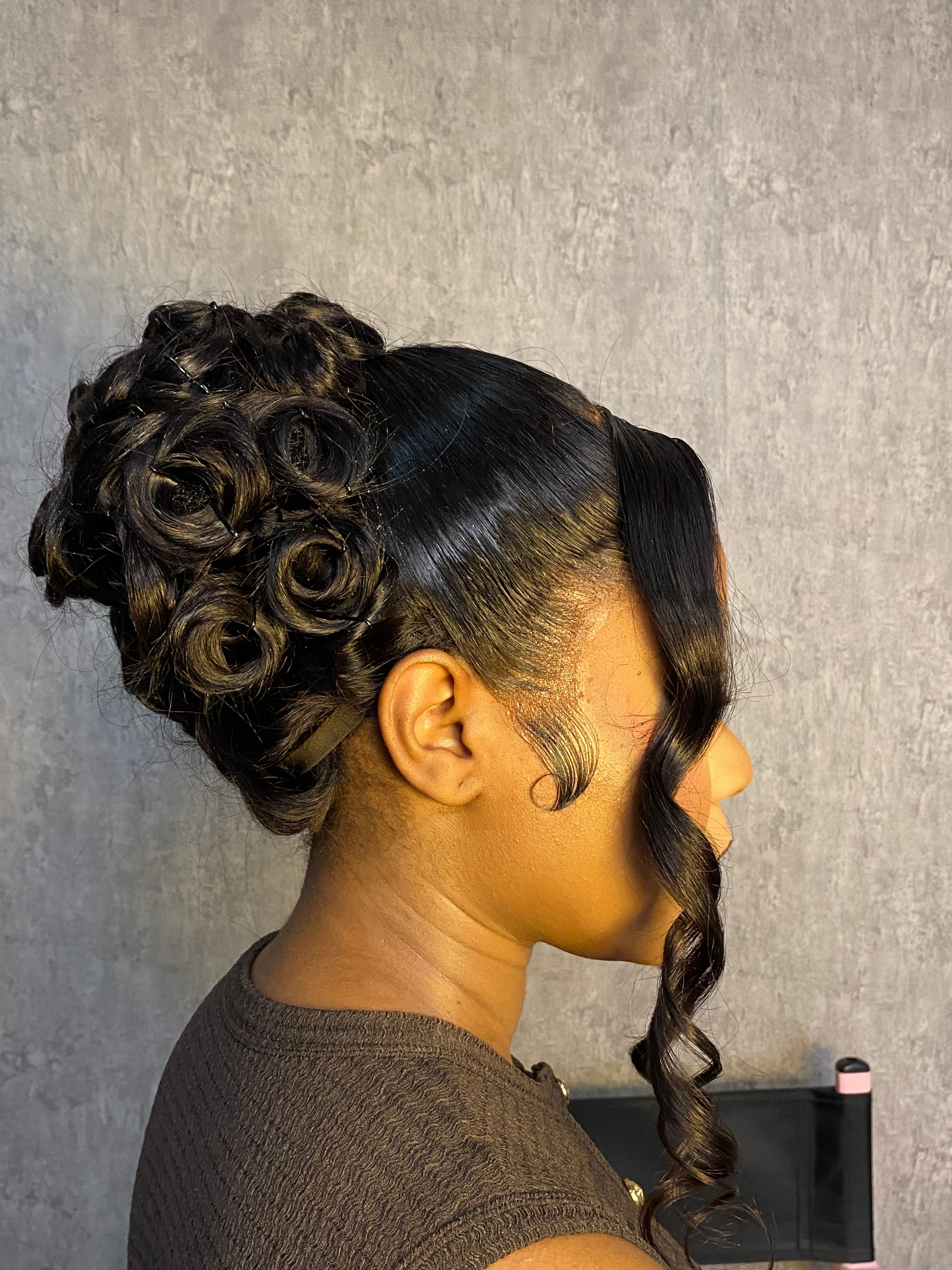 Bombshell French roll updo with bangs